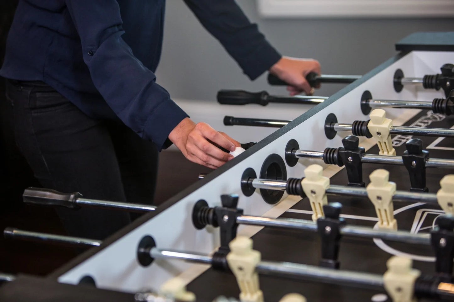 Atomic pro force 56" foosball table with internal ball return and ball entry, leg levelers, and heavy-duty legs