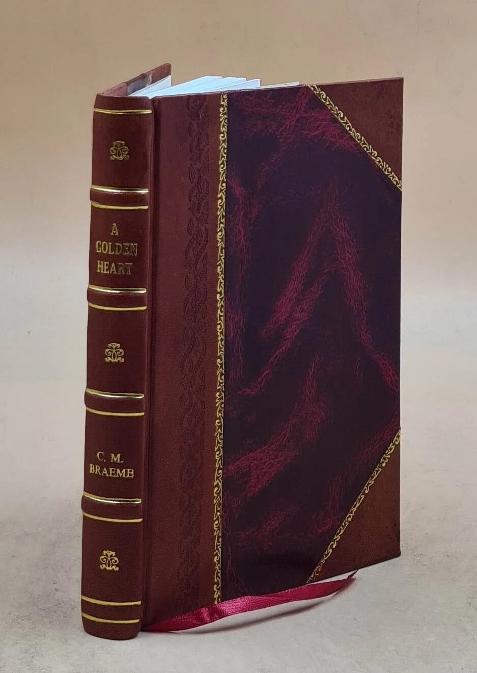 A golden heart, by charlotte m. braeme. 1889 [leather bound]